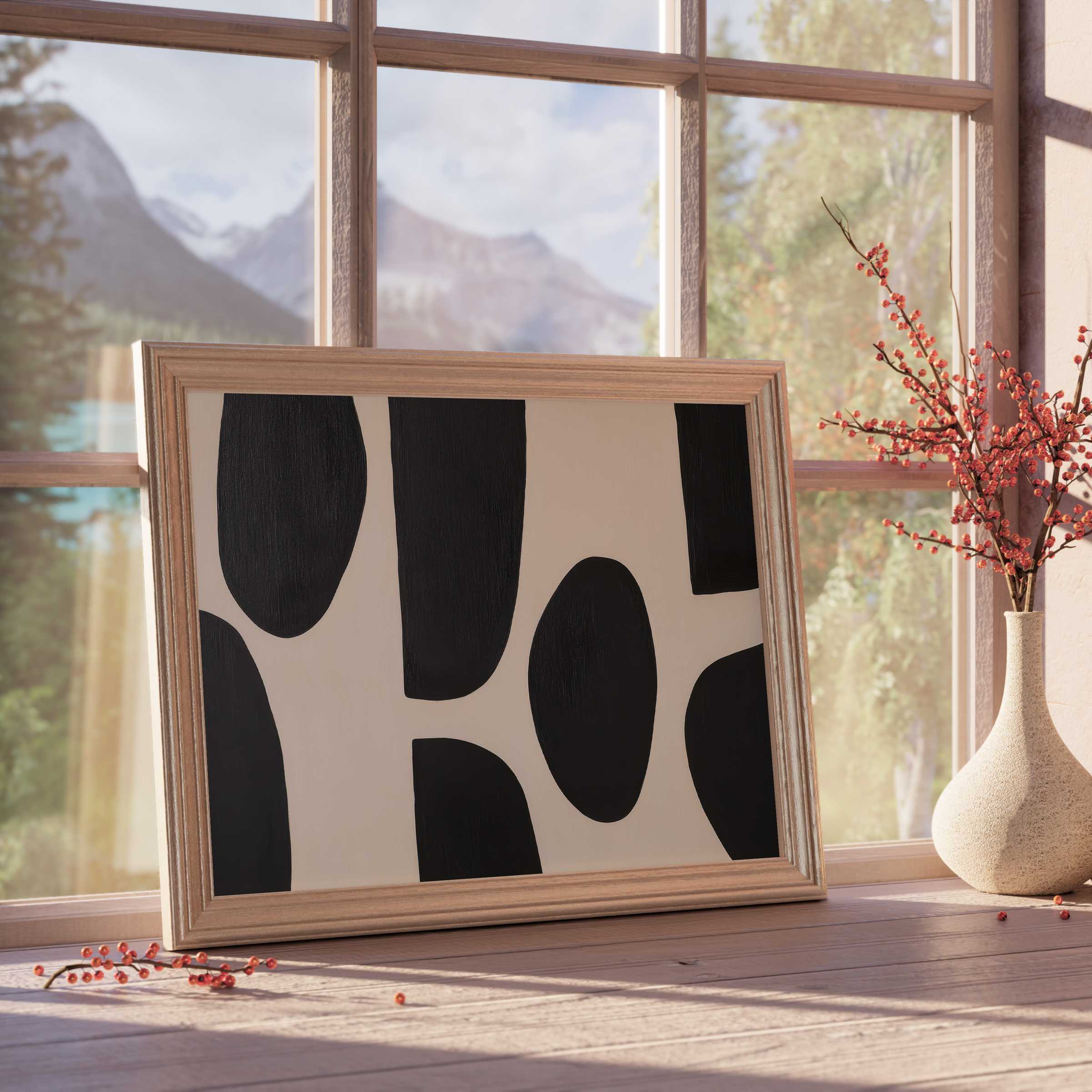 Minimalist abstract downloadable art with bold black shapes, framed in natural wood, elevating serene, modern, design-forward interiors