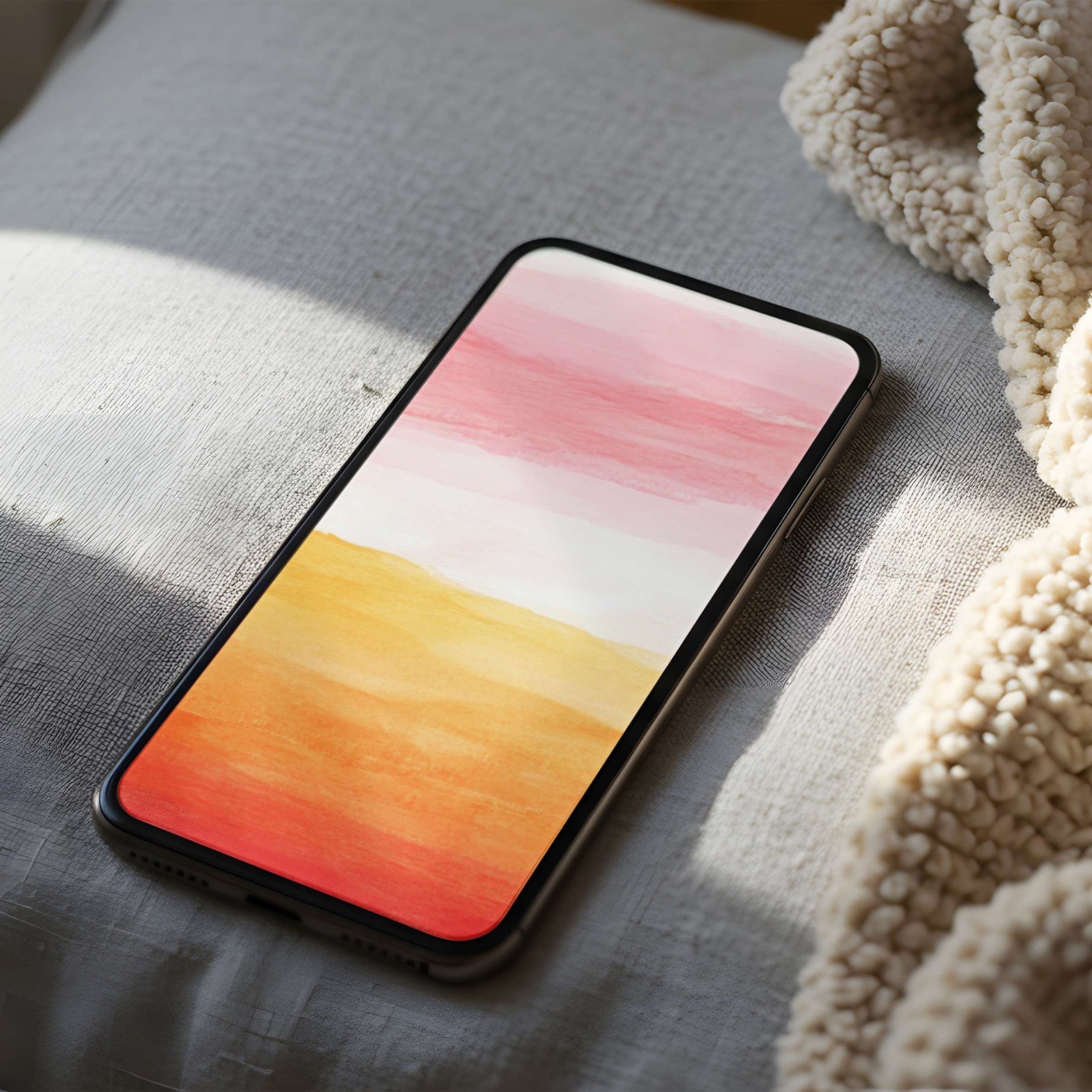 Abstract phone wallpaper featuring soft watercolor sunset tones in warm peach, pink, and gold - a calm and uplifting background for an elegant, modern home screen