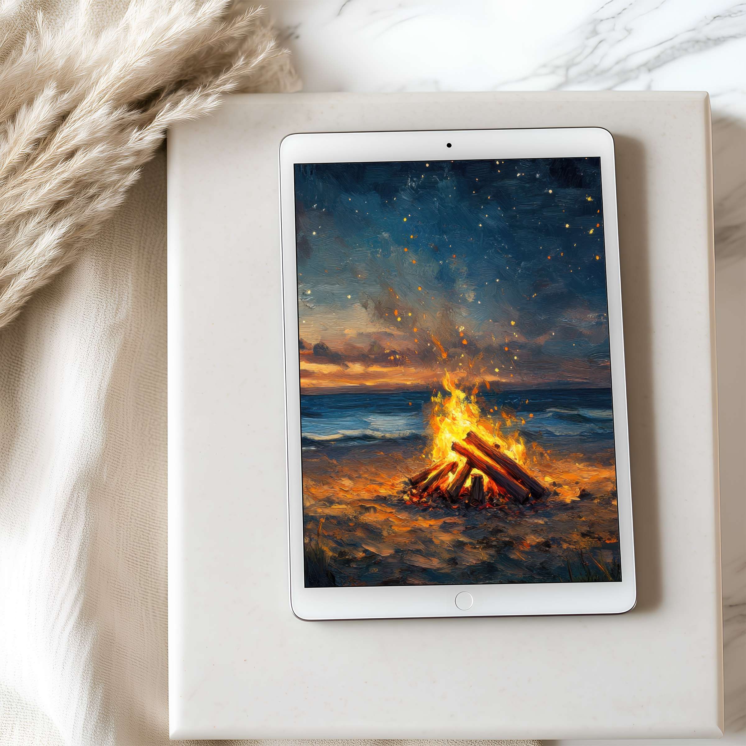 Elegant tablet wallpaper featuring a serene beach bonfire with a starry sky in high resolution, ideal for iPad or Android download