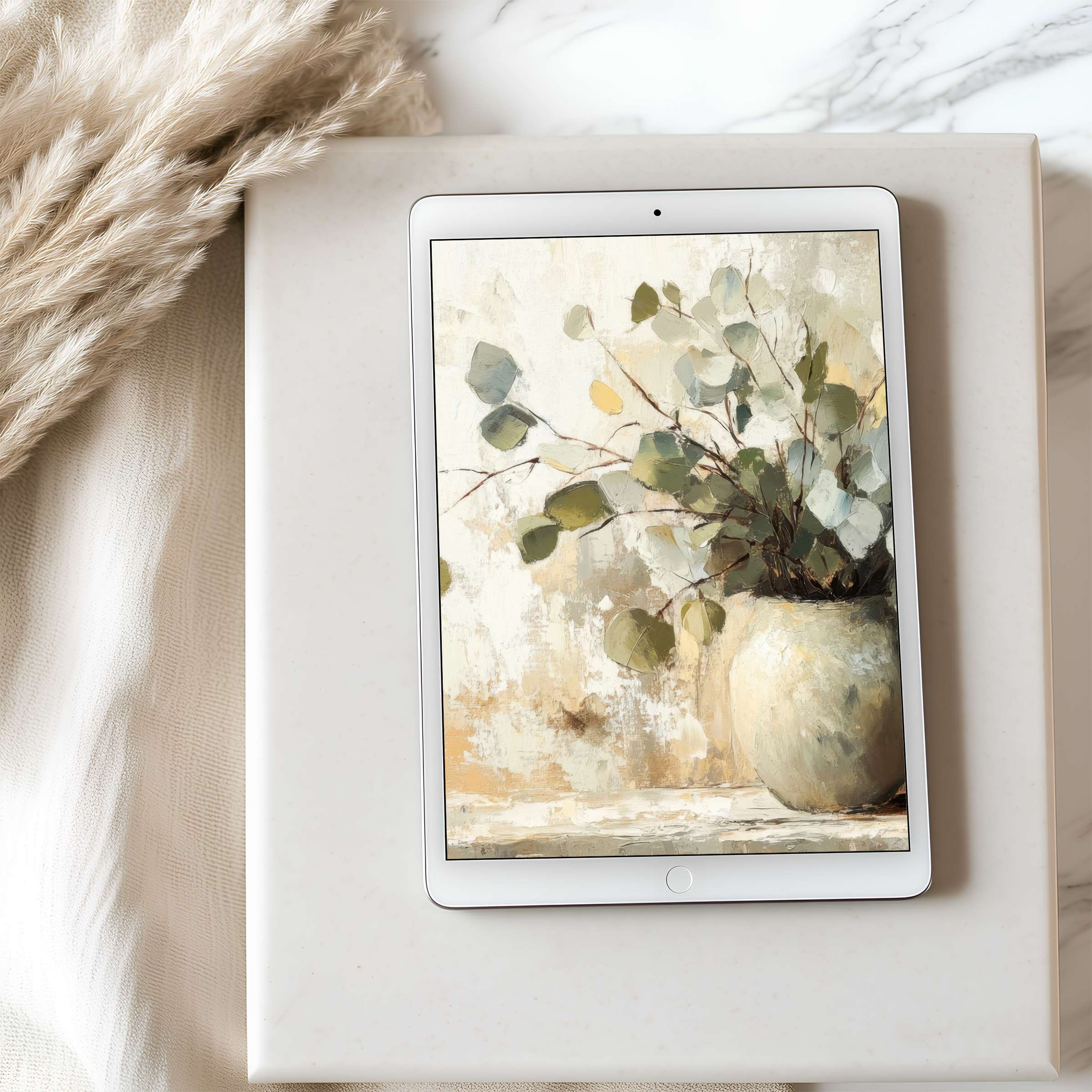 Elegant tablet wallpaper featuring serene botanical art in muted tones on iPad against a stylish marble setting elevates digital spaces