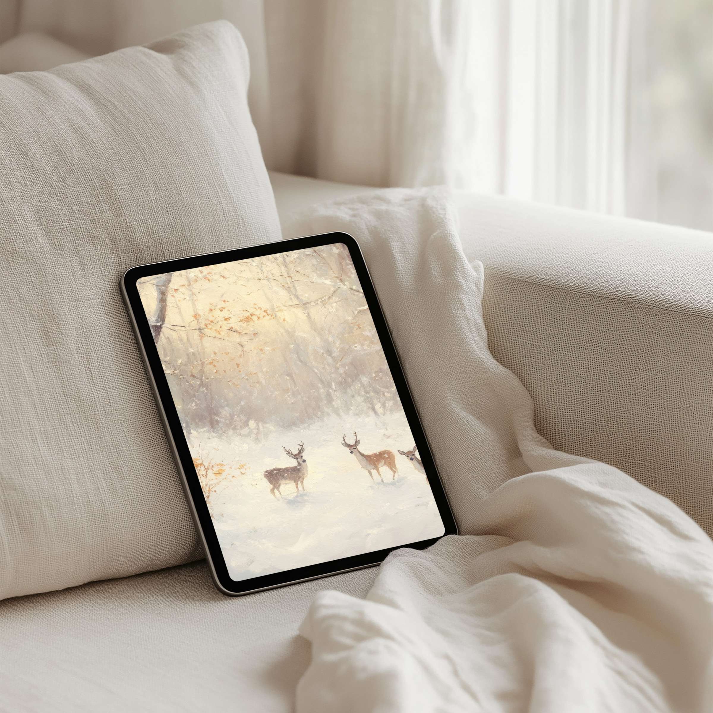 Elegant iPad background featuring serene deer in a soft, winter landscape for instant download on any tablet, inspiring calm