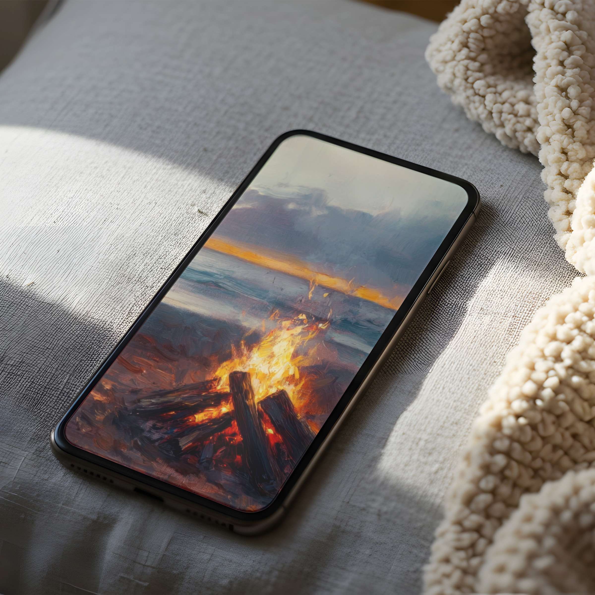 Elegant beach sunset with bonfire phone wallpaper in high resolution for iPhone and Android download inspiring tranquility