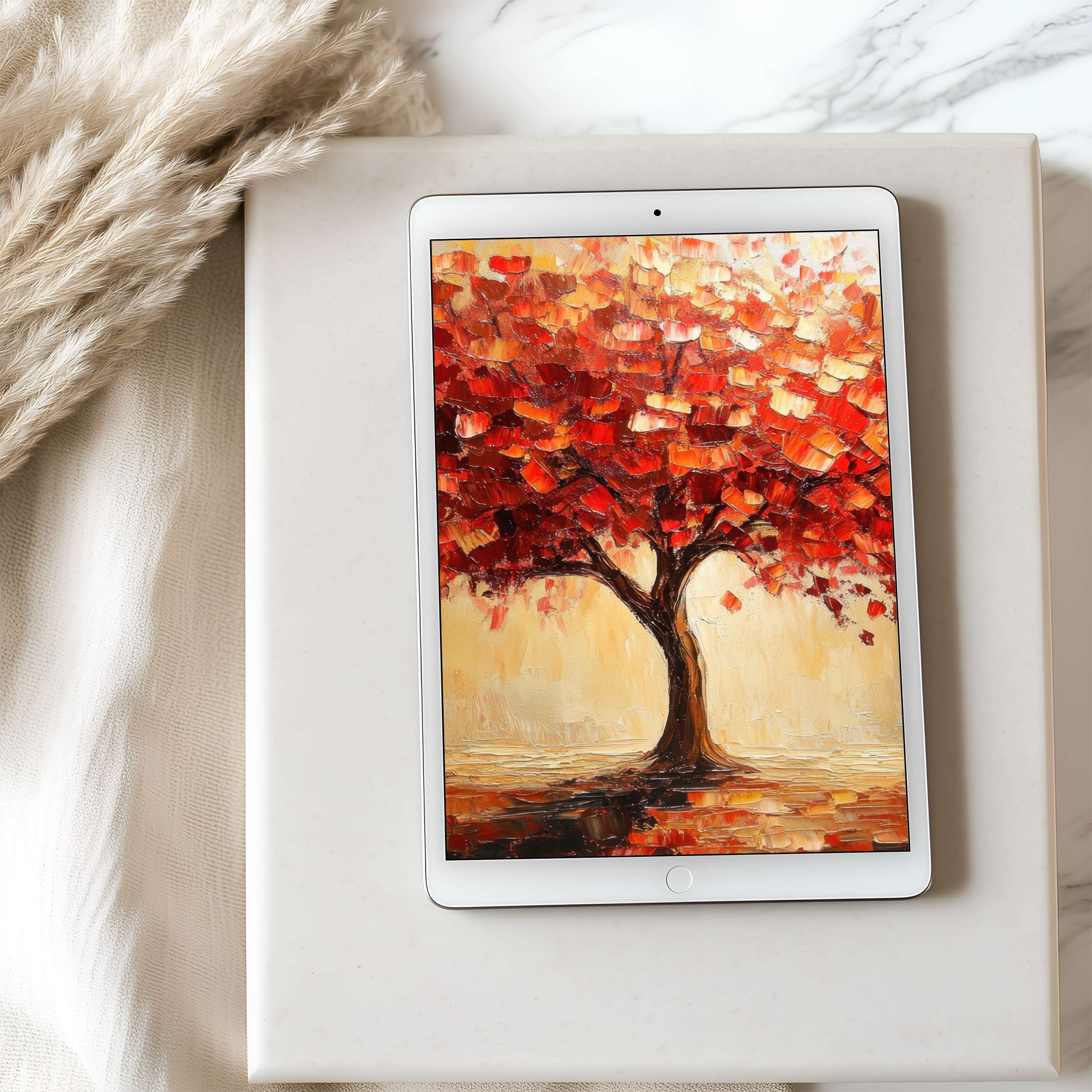 Elegant autumn tree digital art as tablet wallpaper on iPad, blending vibrant red hues for a serene and stylish download experience