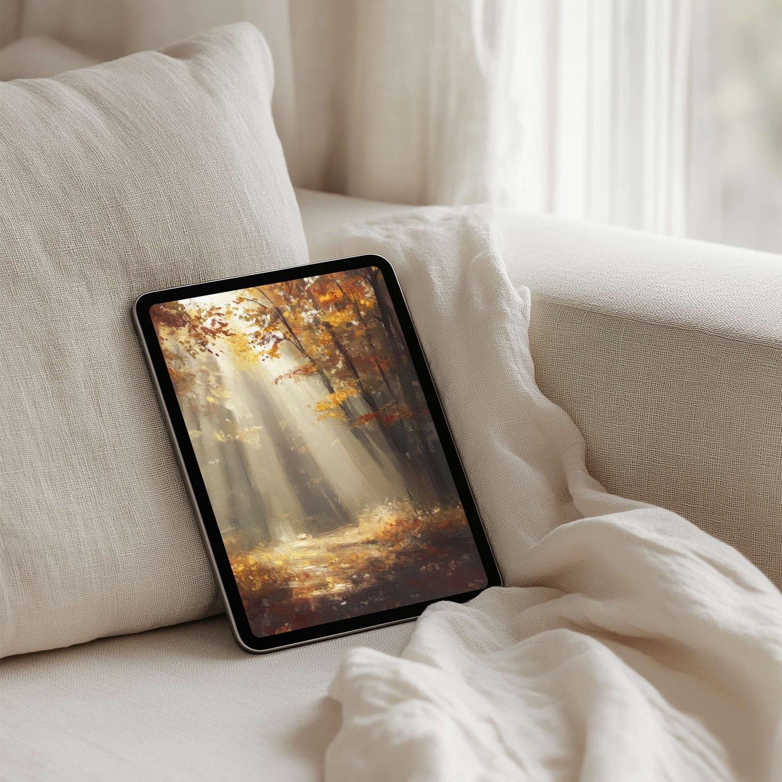 Fall iPad wallpaper with warm autumn forest scene and golden light rays, cozy seasonal tablet background that brings warmth, depth, and natural beauty to your digital space