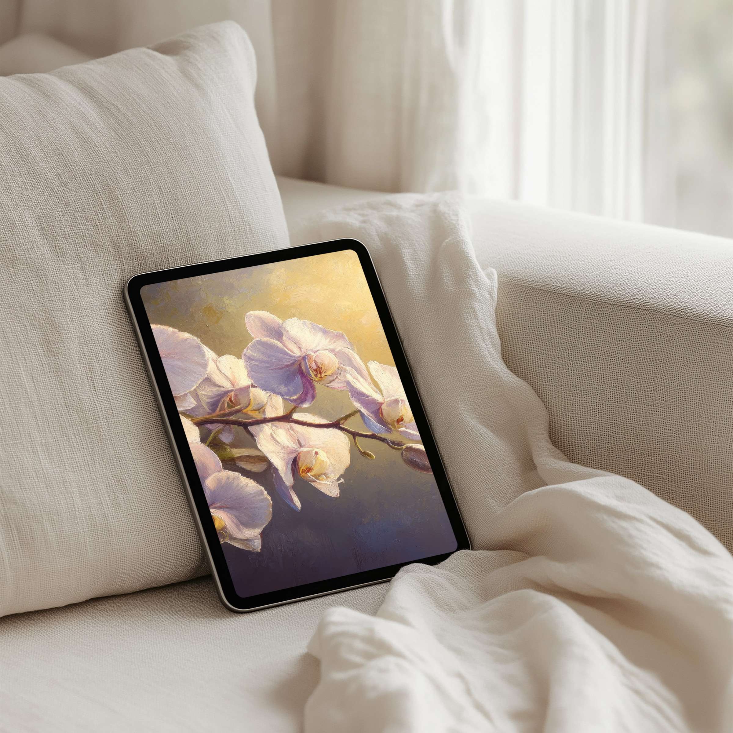 Elegant orchid iPad background on a cozy sofa offers calm inspiration for your tablet with instant download for design lovers