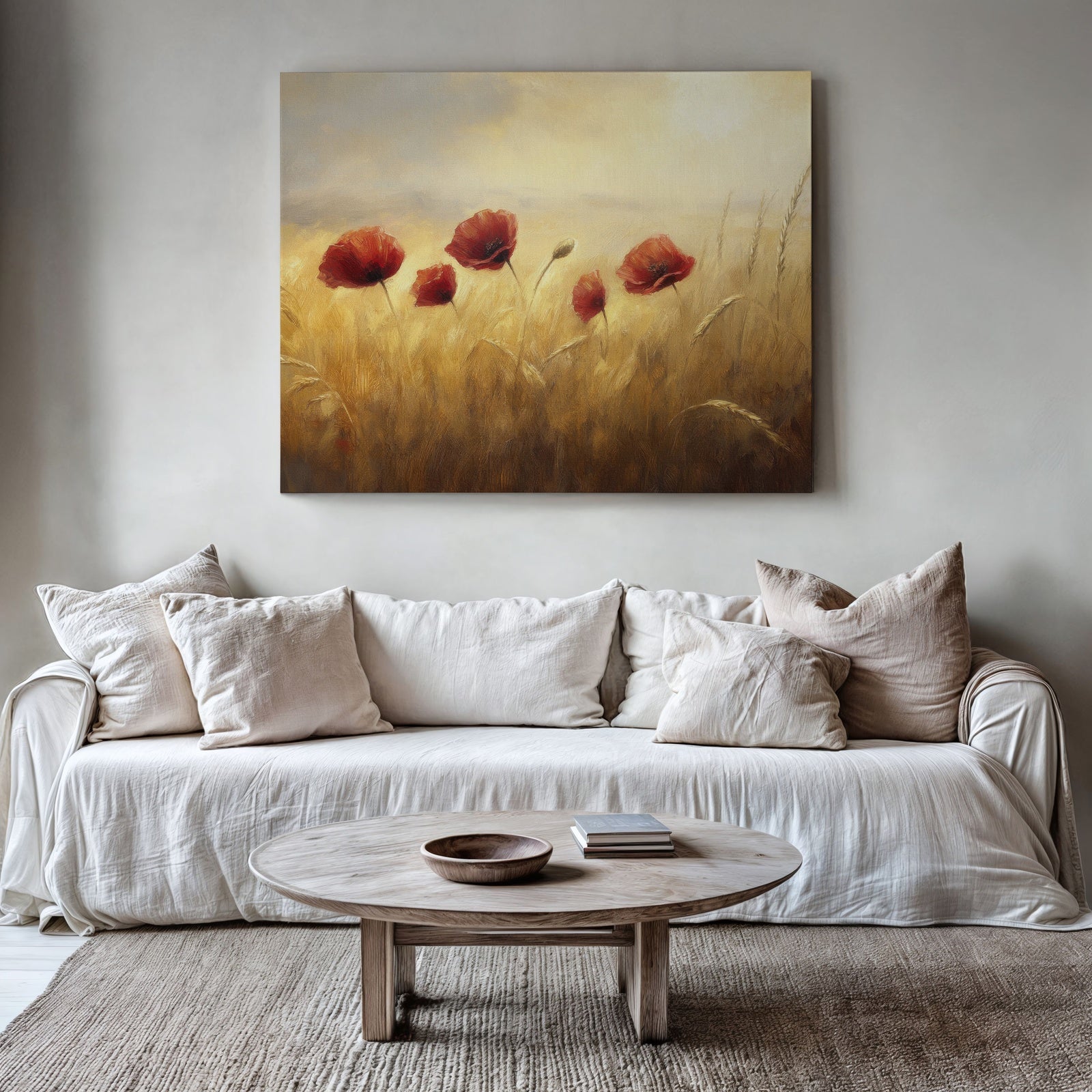 A minimalist living room in neutral tones featuring a large framed digital art print of red poppies swaying in a golden field. The soft, painterly floral artwork adds warmth and natural beauty to the cozy, elegant decor
