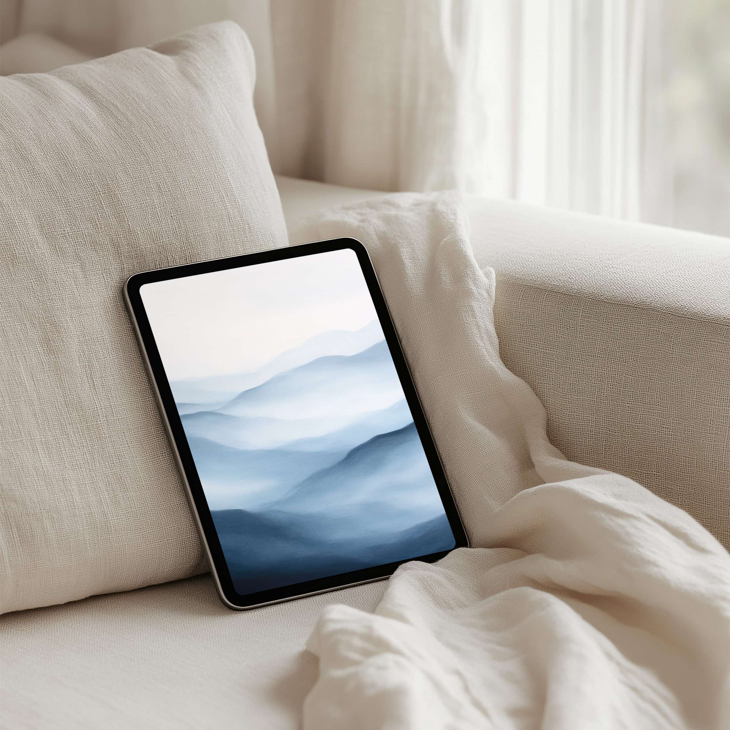 Serene blue mountains iPad background on a tablet evokes calm and elegance, perfect for instant download to inspire mindfulness
