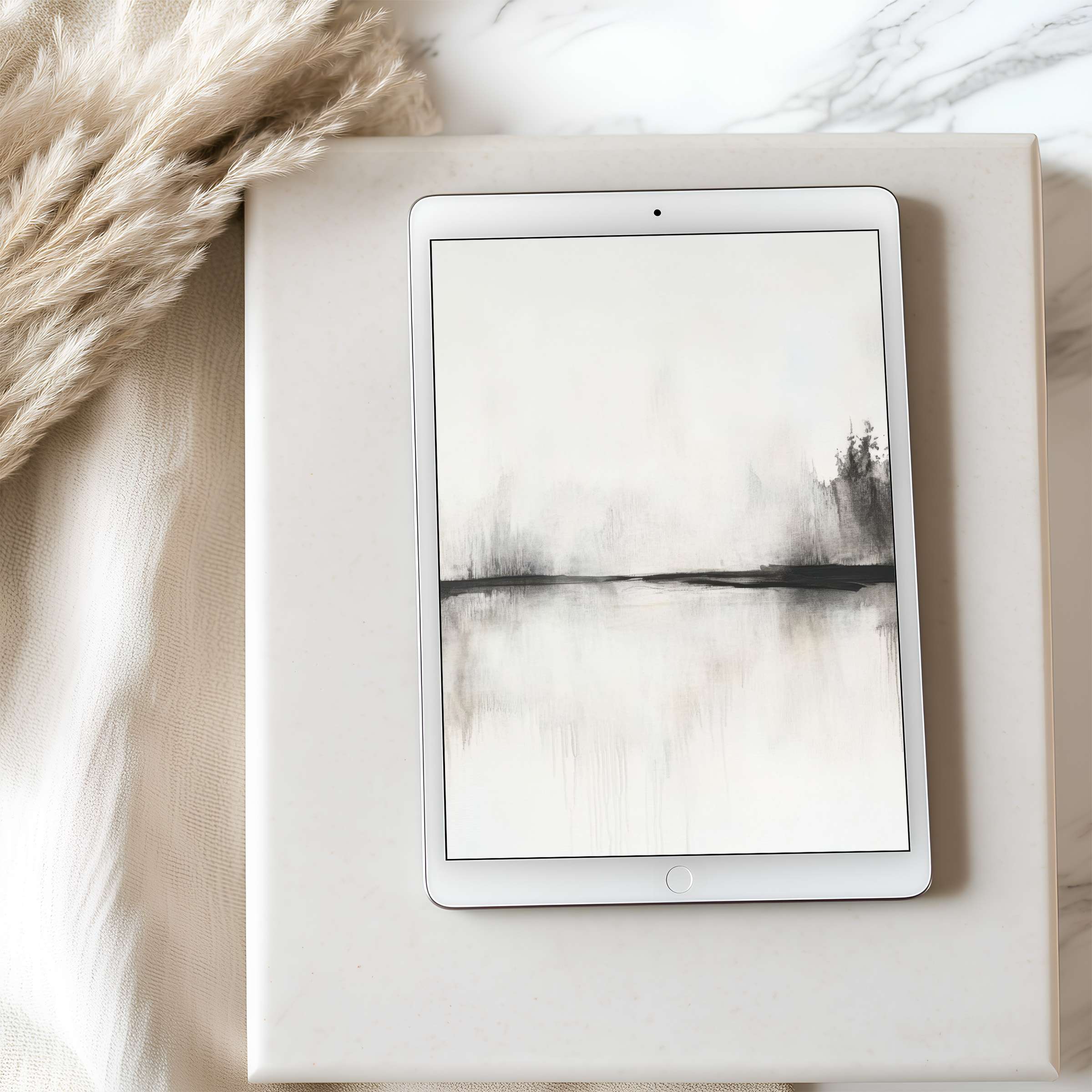 Elegant tablet wallpaper featuring serene monochrome landscape art on iPad set against a minimalist interior for calming inspiration