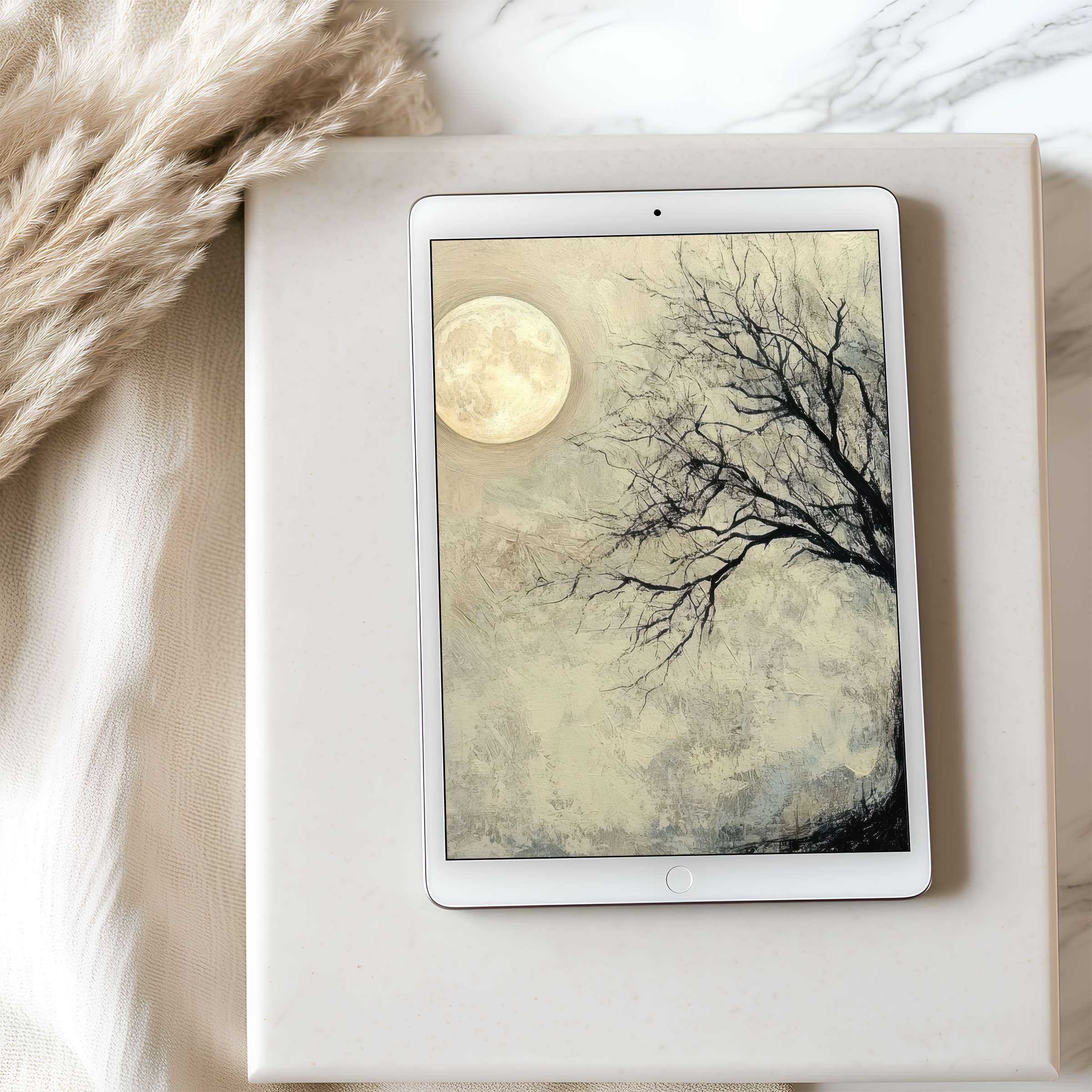 Elegant tree silhouette against a full moon on a tablet wallpaper provides serene charm for high-resolution digital downloads