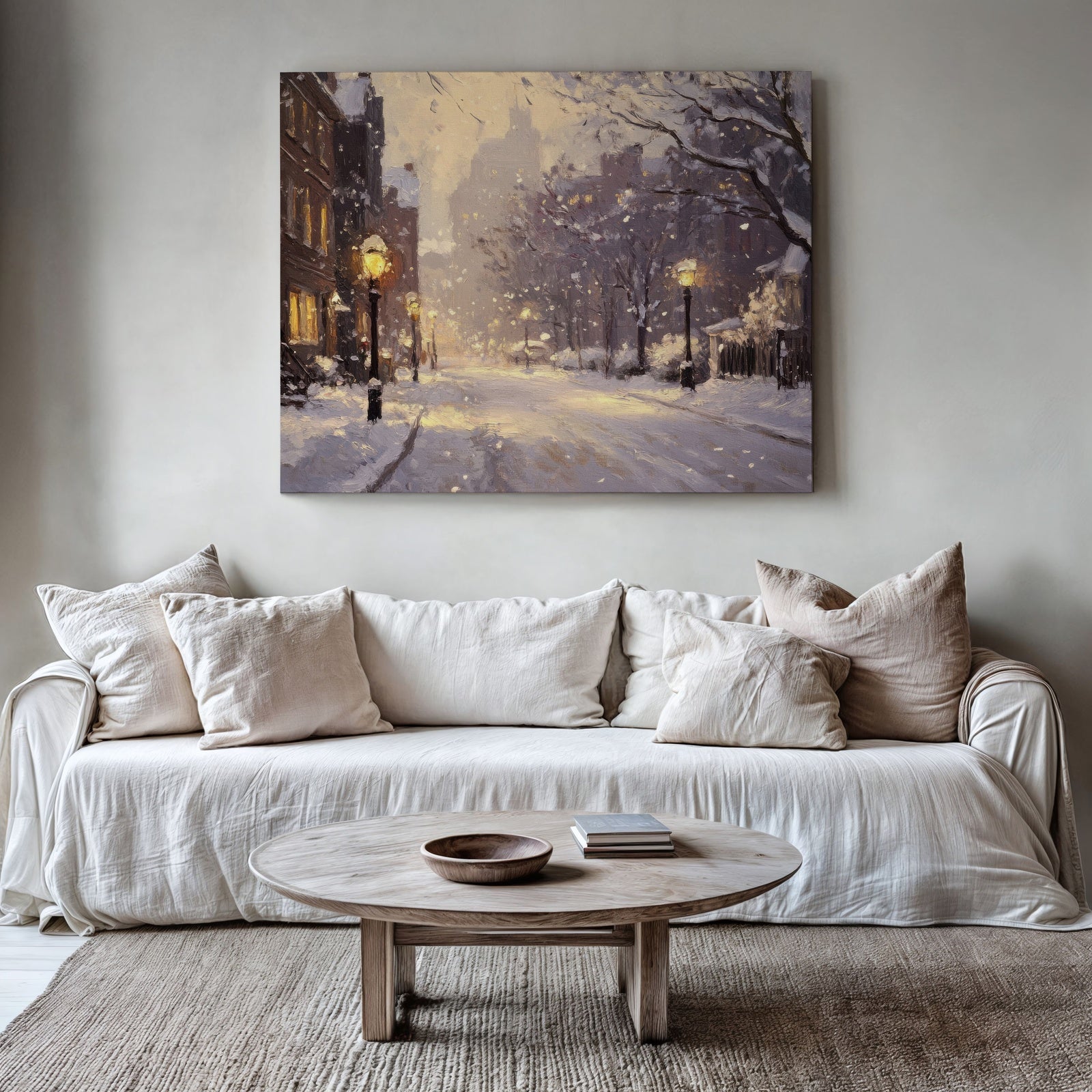 A minimalist living room with neutral tones featuring a large framed digital art print of a snowy city street illuminated by warm streetlights. The urban winter scene adds depth and coziness to the modern decor, blending elegance with metropolitan charm
