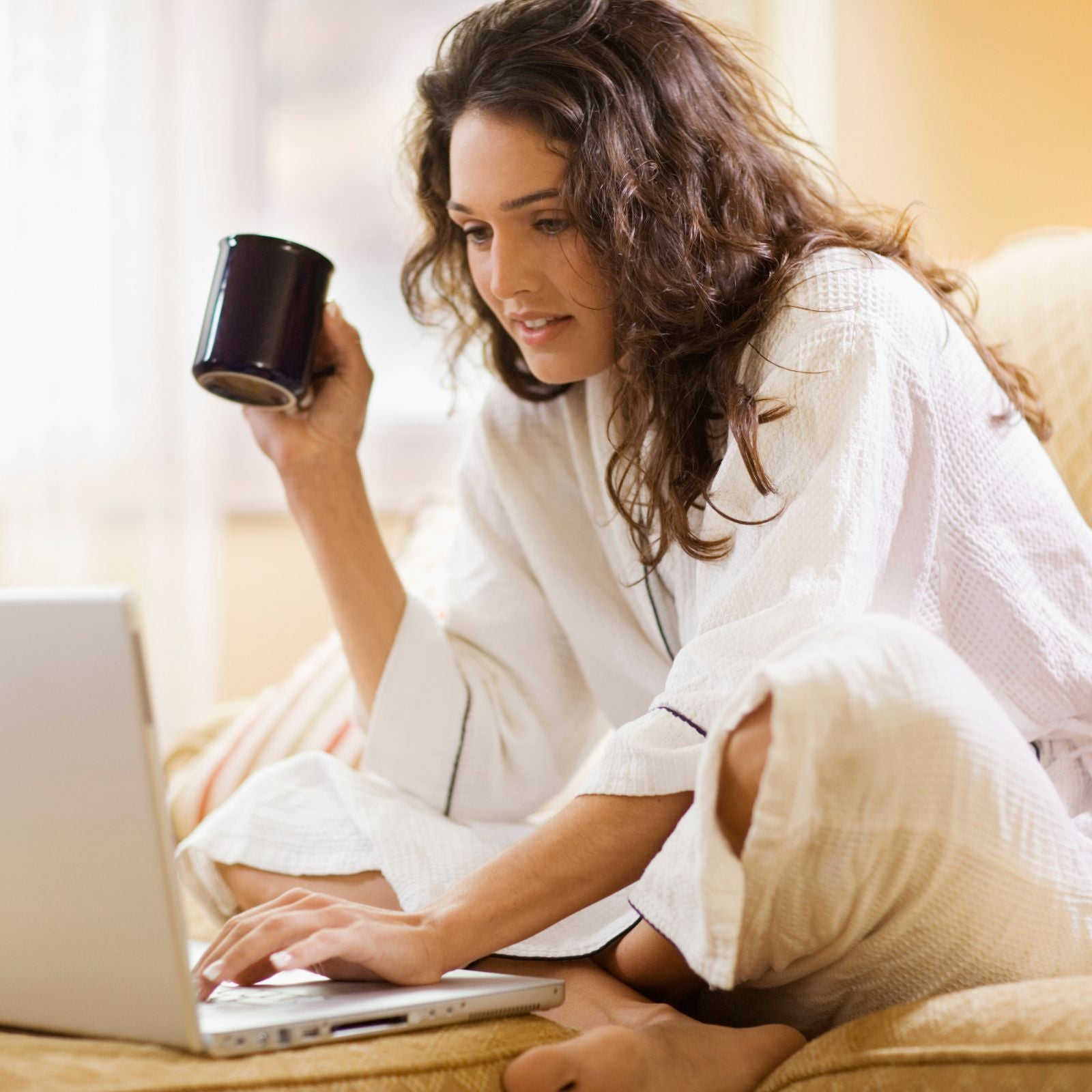 Woman with notebook in living room
