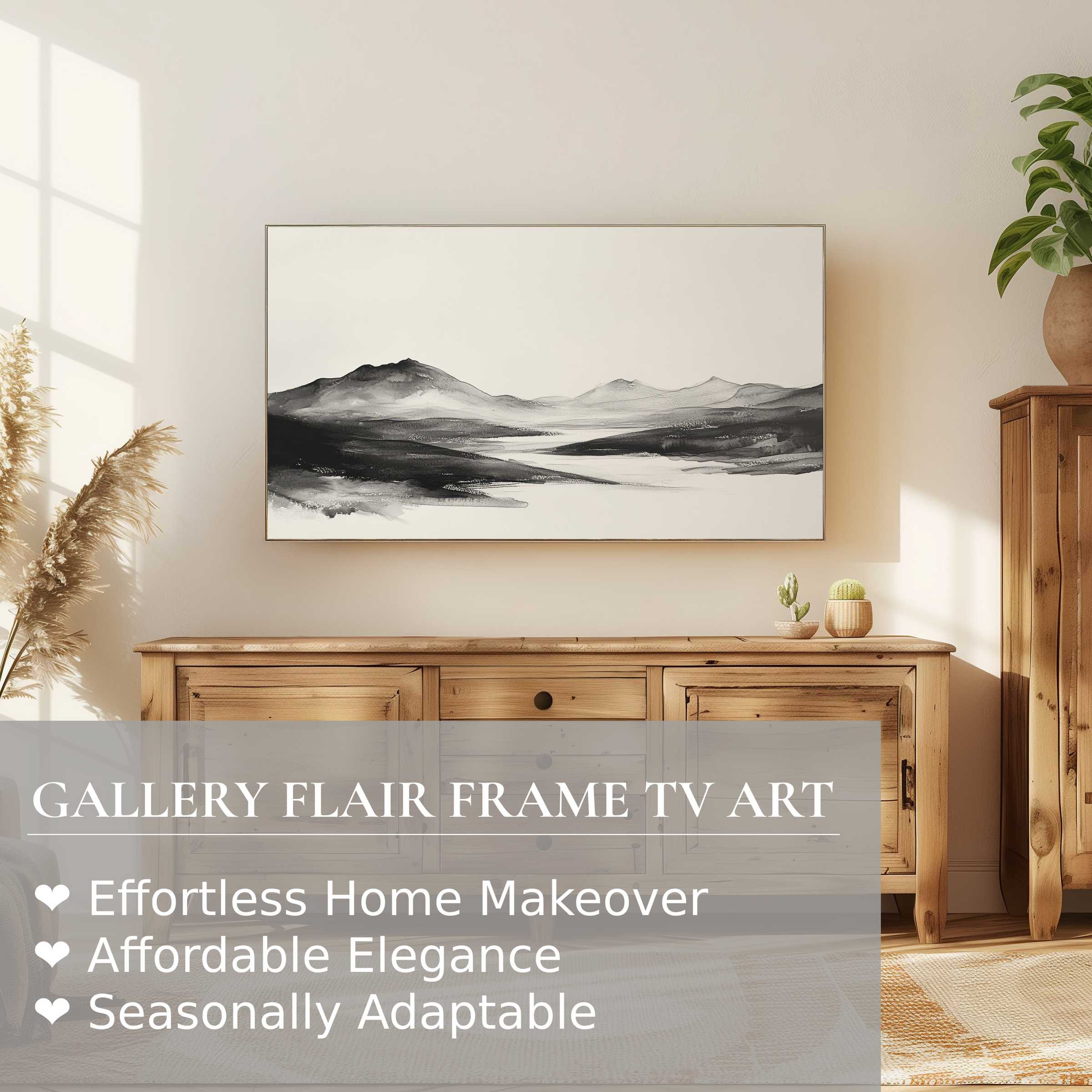 Samsung Frame TV displaying black and white digital artwork of serene mountains in a modern, elegant living space