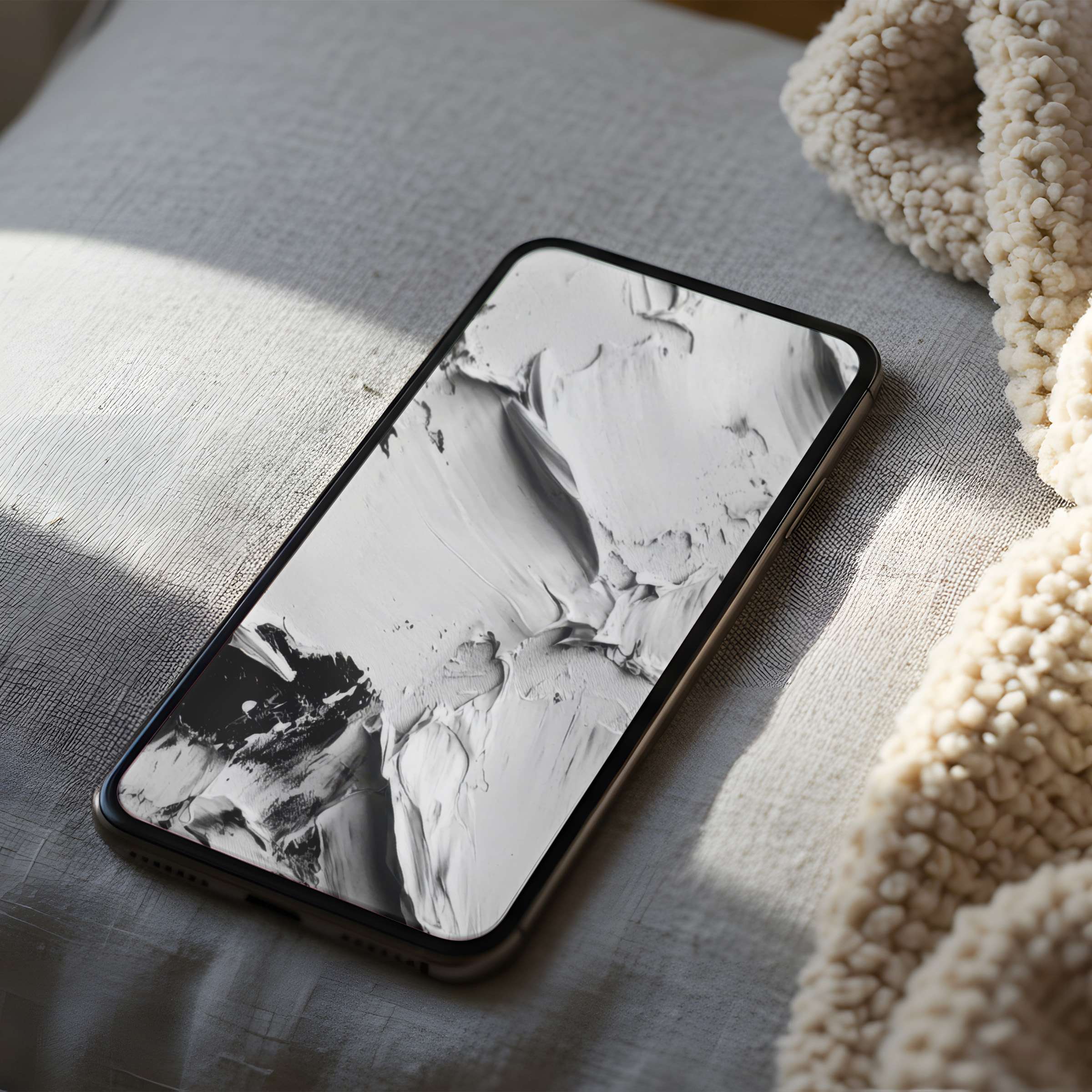 Elegant phone wallpaper featuring serene monochrome abstract art on a soft cushion setting elevates any iPhone or Android screen