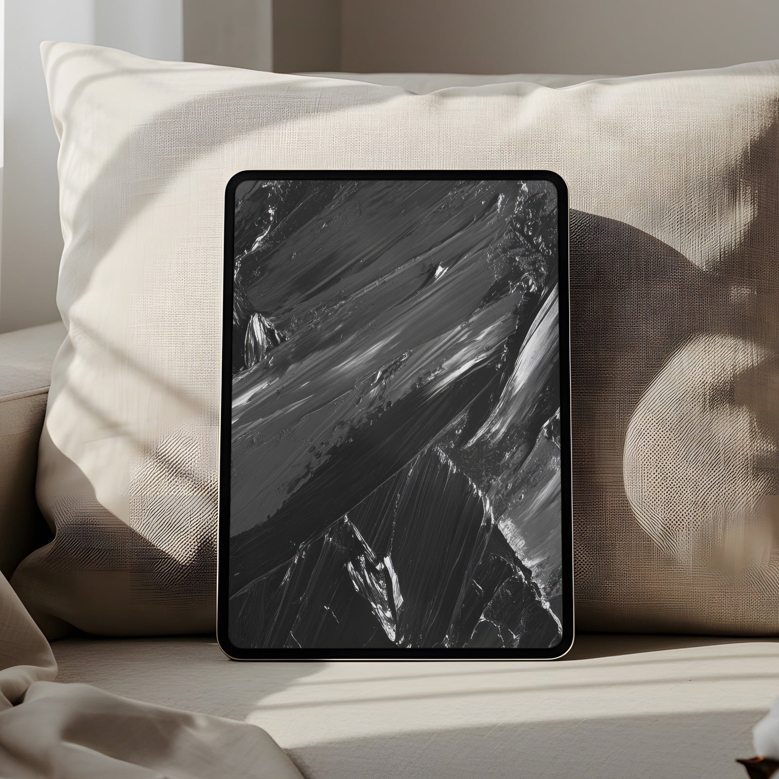Abstract iPad wallpaper featuring bold black brushstrokes with rich texture and depth. A modern and artistic digital background that adds sophistication, drama and minimalist elegance to your tablet screen