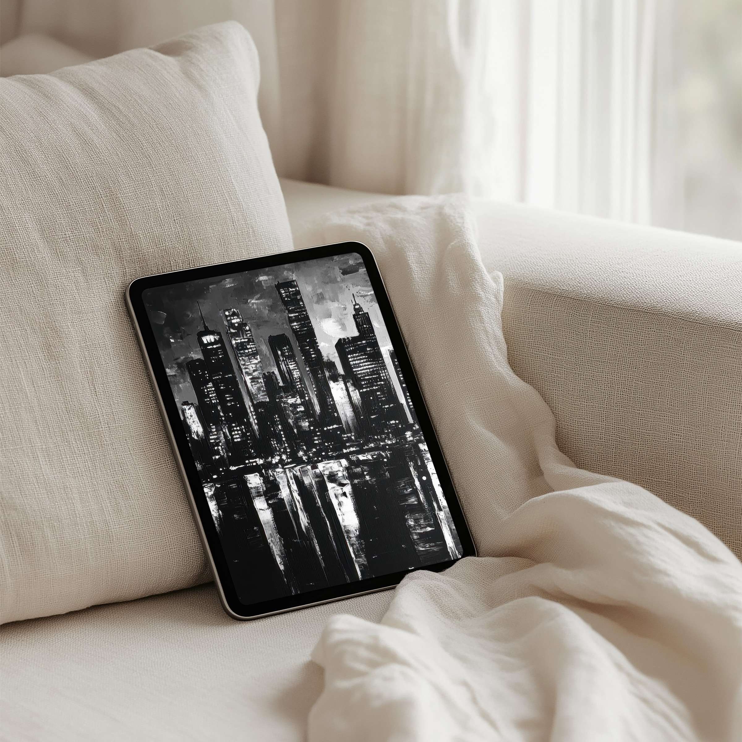 Elegant black and white cityscape iPad background on a cozy sofa evokes calm and mindfulness, perfect for instant download on tablets