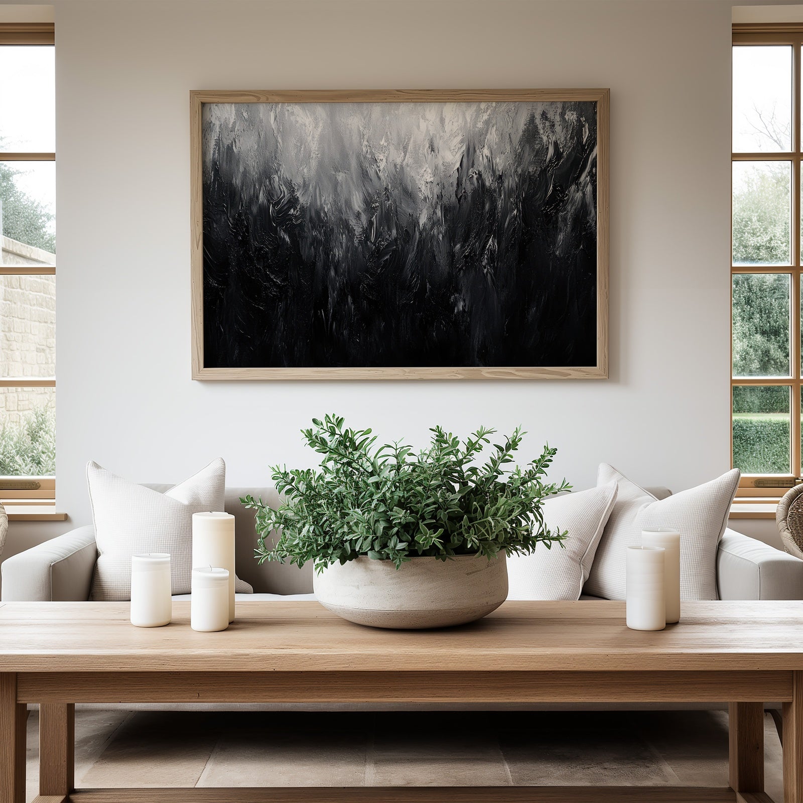 Black and white abstract printable wall art with textured dark and light tones, displayed in a bright modern living room with neutral furniture and natural wood accents