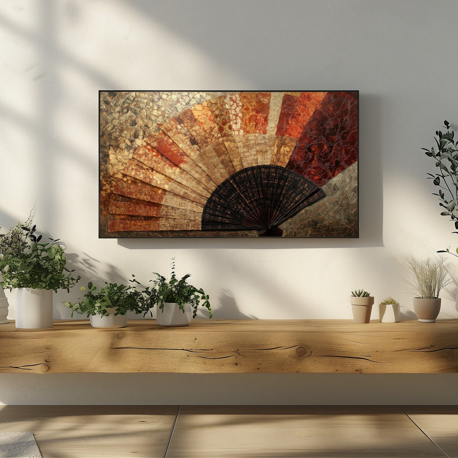 Boho Frame TV Art with vintage hand fan in earthy red and gold tones displayed above a rustic wooden shelf with greenery in a sunlit modern living room