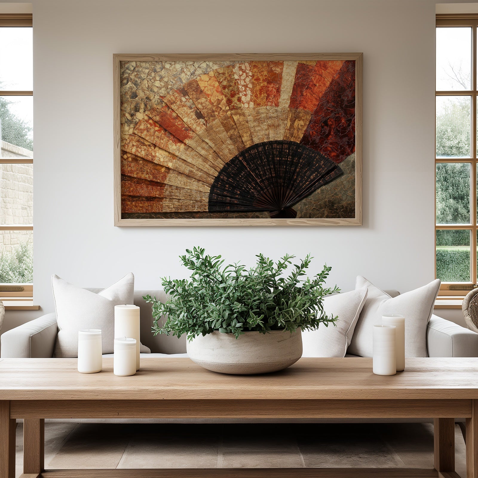 Boho printable wall art featuring a textured hand-fan design in warm earthy tones, displayed in a bright modern living room with neutral furniture, natural wood accents, and soft greenery