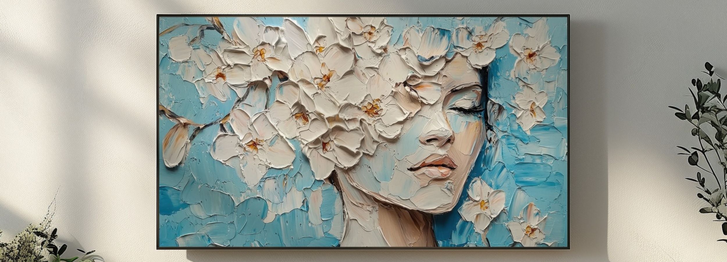 Botanical textured portrait artwork with white floral oil-paint details on a calm blue background displayed on a Samsung Frame TV in a modern living room