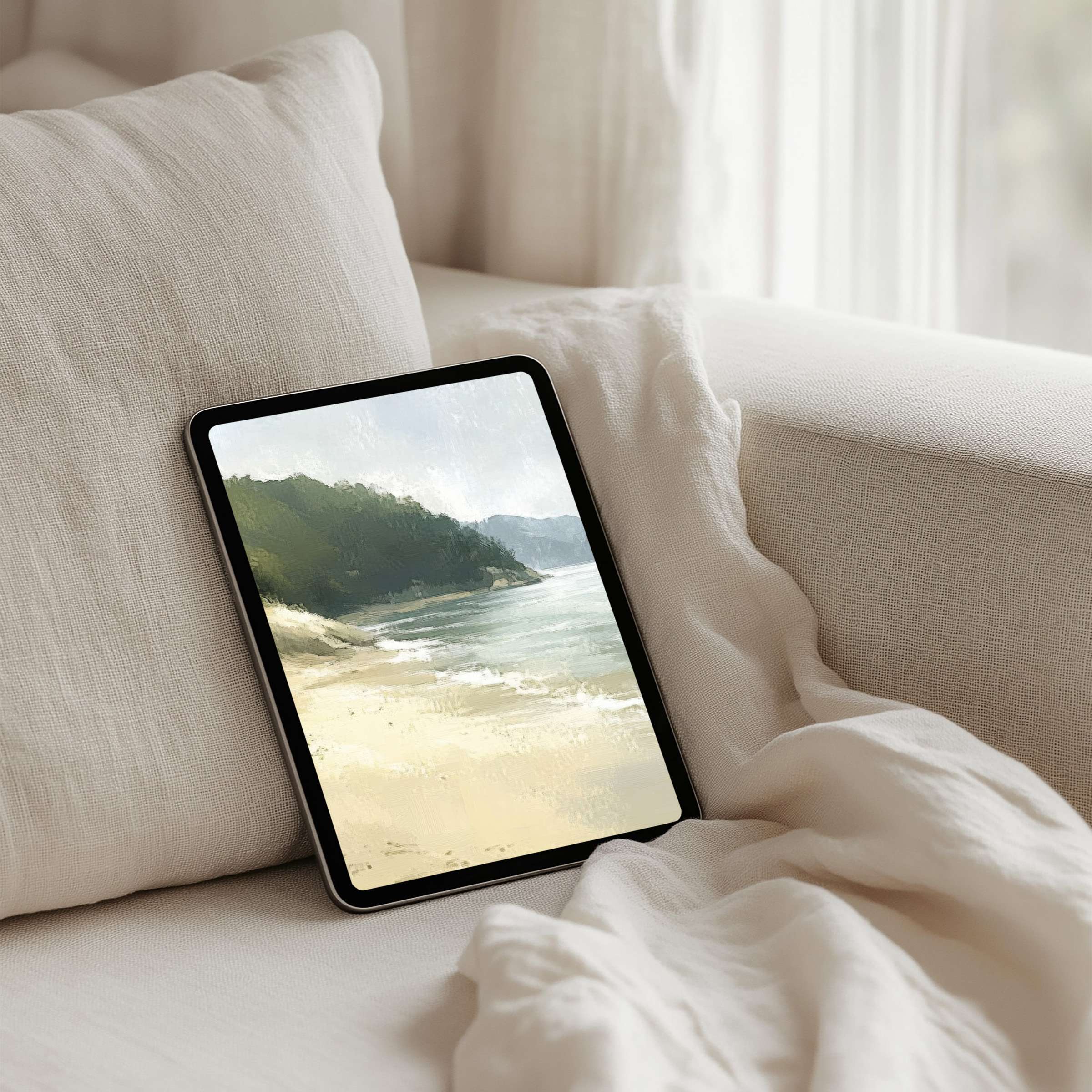 Serene coastal artistry graces an iPad background on a soft sofa for a calming, instant download to elevate your tablet experience