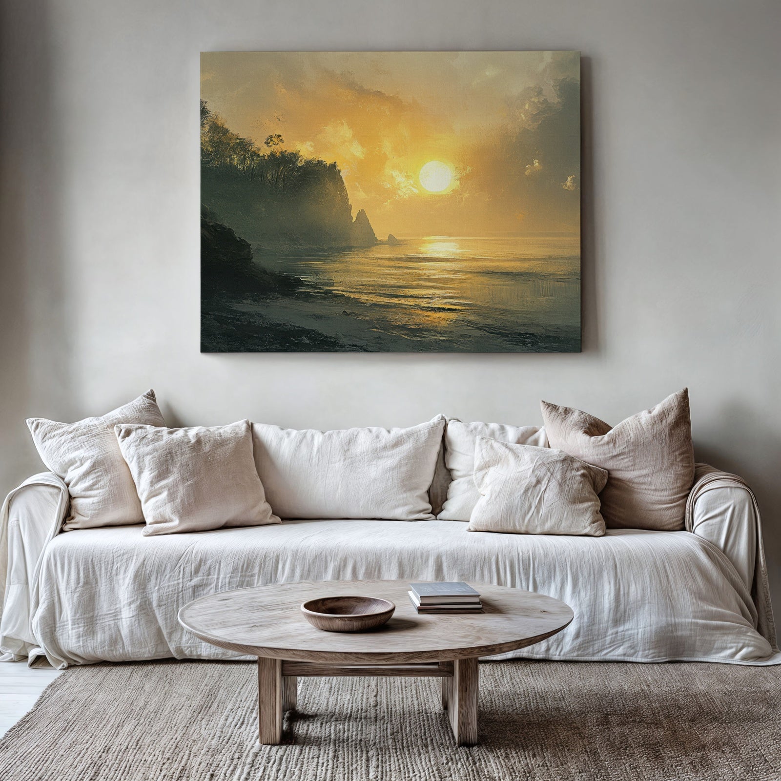 Coastal printable wall art featuring a golden sunset over the ocean with cliffs and soft waves, adding a serene and warm atmosphere to a modern neutral living room