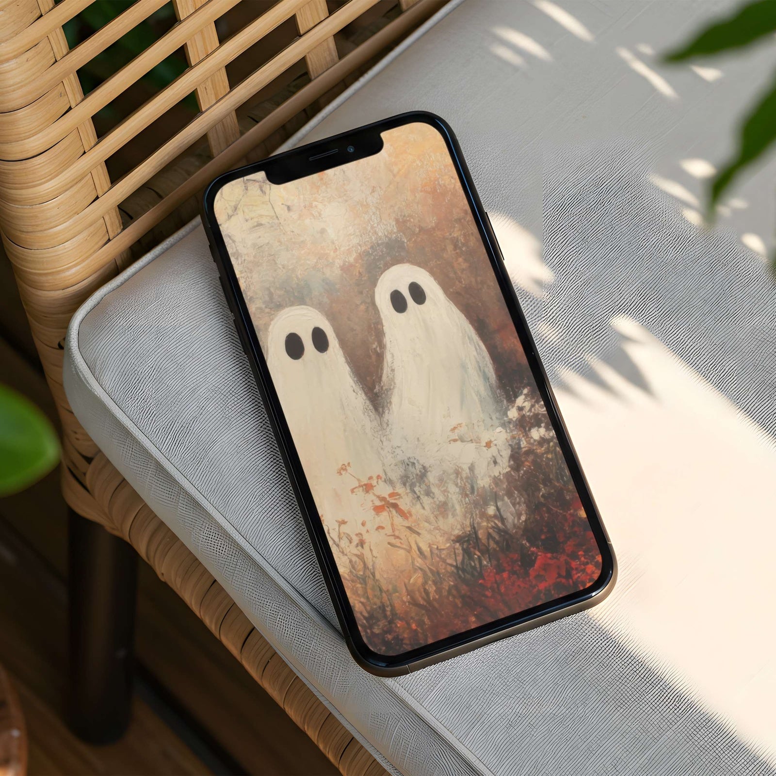 Cute Halloween iPhone background featuring two soft, friendly ghost figures in a warm autumn landscape, painted in cozy neutral tones for a charming, seasonal aesthetic