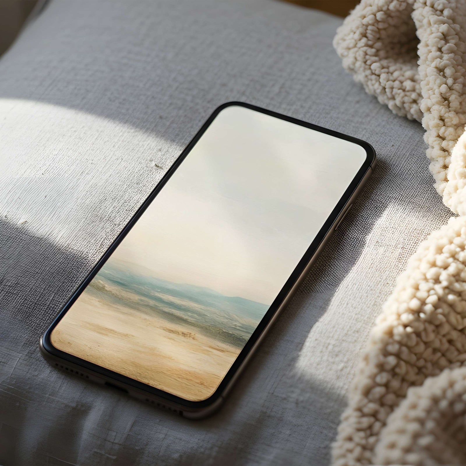 Soft landscape phone wallpaper featuring gentle desert tones and distant blue hills - a calm, airy and elegant background for a serene, minimalist home screen
