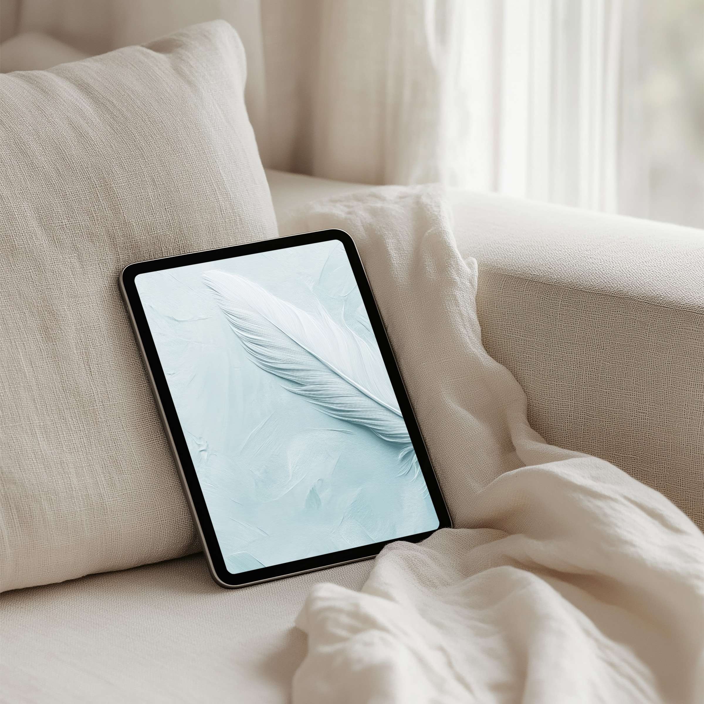 Elegant iPad background featuring a soft feather on a pastel backdrop ideal for instant download on any tablet infusing calm and serenity