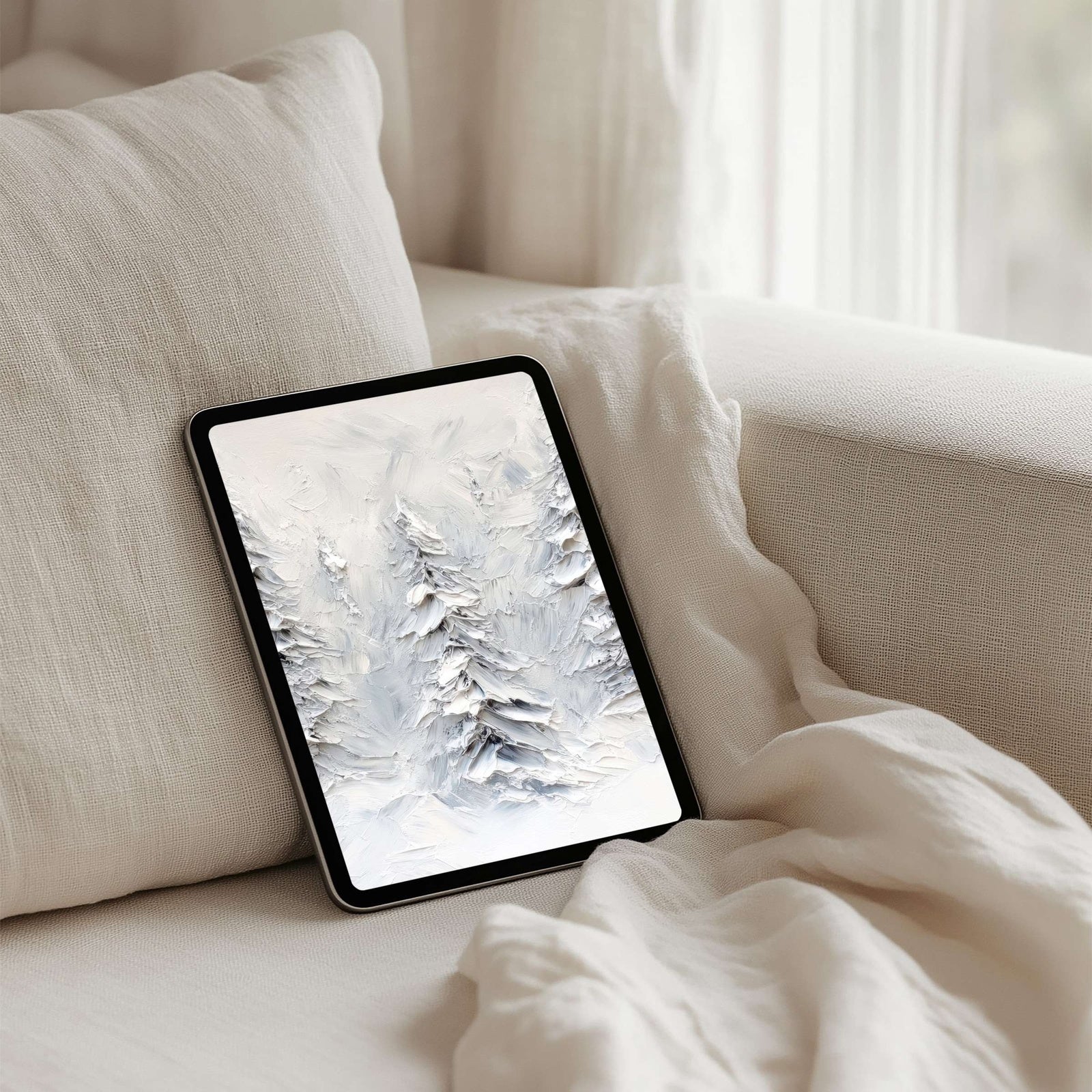 Winter iPad wallpaper with snowy alpine trees in soft white and gray tones, serene impressionist tablet background that brings calm, elegance, and seasonal charm to your digital space