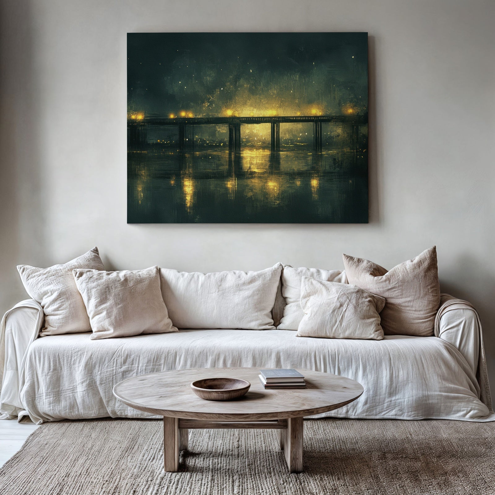 Urban printable wall art featuring a glowing city bridge at night reflected in calm water, displayed above a neutral-toned sofa in a cozy modern living room
